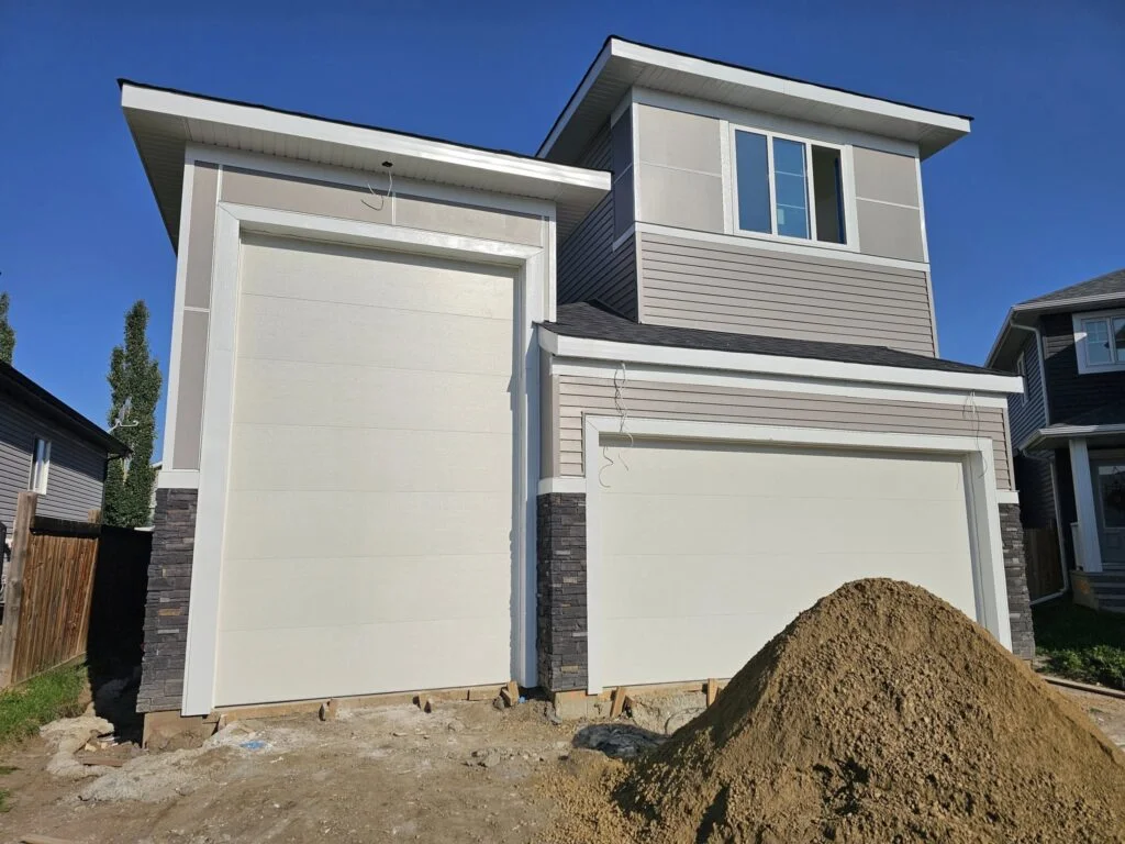 New house with unfinished garage door area